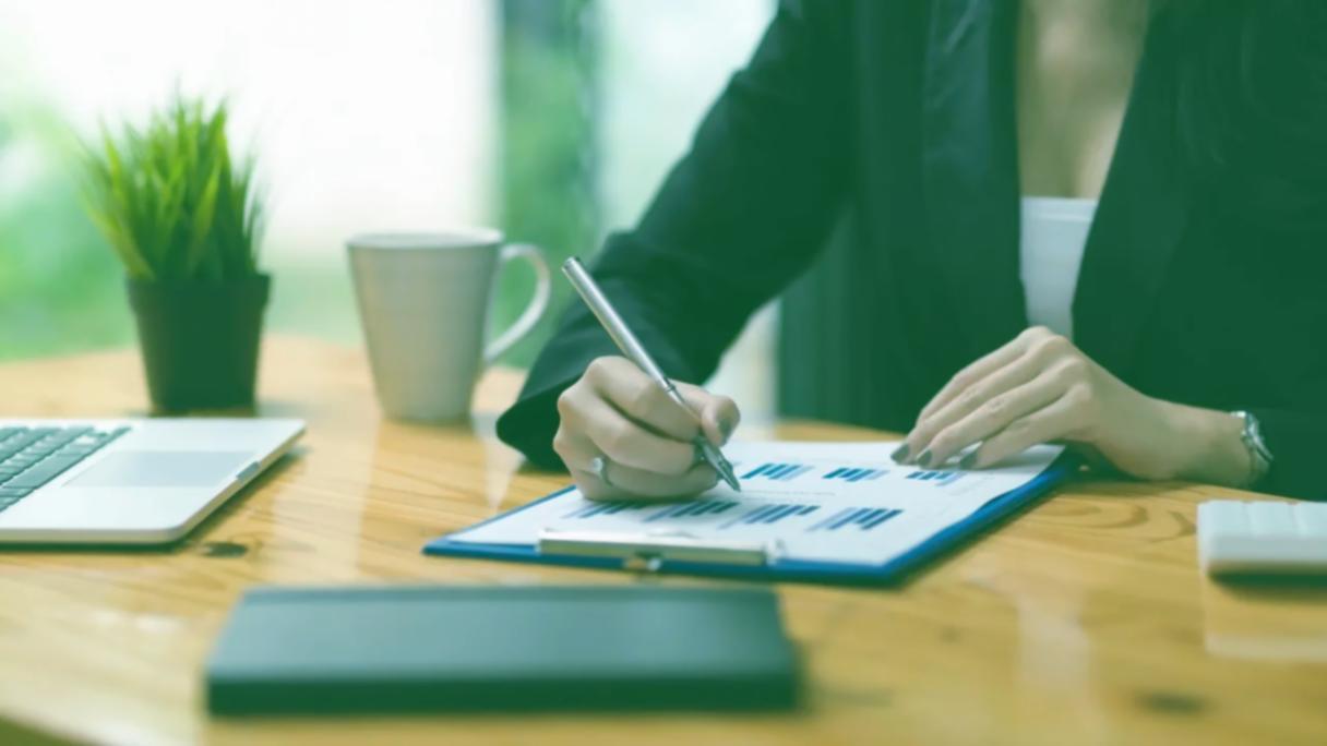 Cash flow budgeting workspace with financial documents
